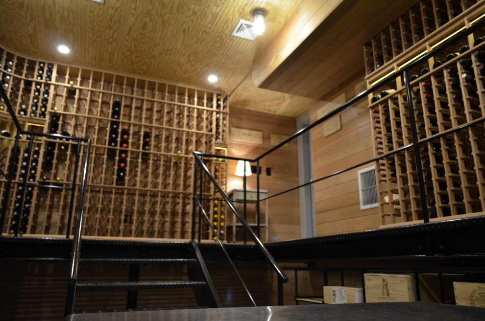 Inspiration for an expansive arts and crafts wine cellar in New York with storage racks.