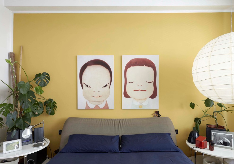 Inspiration for a contemporary master bedroom in Florence with yellow walls.