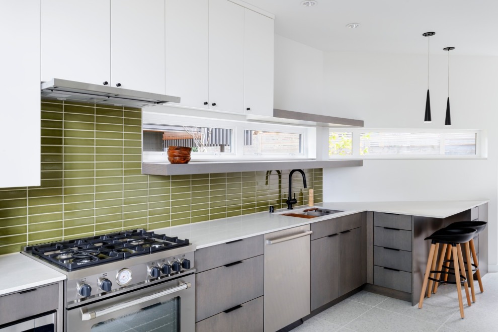 This is an example of a small contemporary single-wall eat-in kitchen in Seattle with an undermount sink, flat-panel cabinets, dark wood cabinets, quartz benchtops, green splashback, ceramic splashback, stainless steel appliances, terrazzo floors, no island, white floor and white benchtop.
