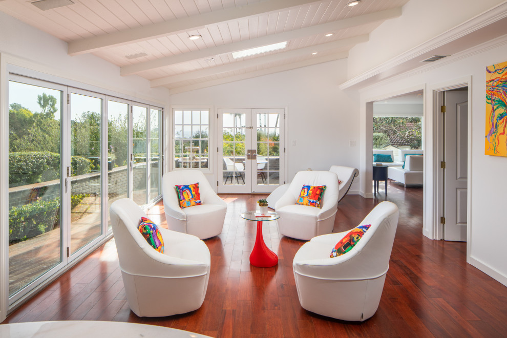 Inspiration for a transitional medium tone wood floor and brown floor sunroom remodel in San Diego with a standard ceiling