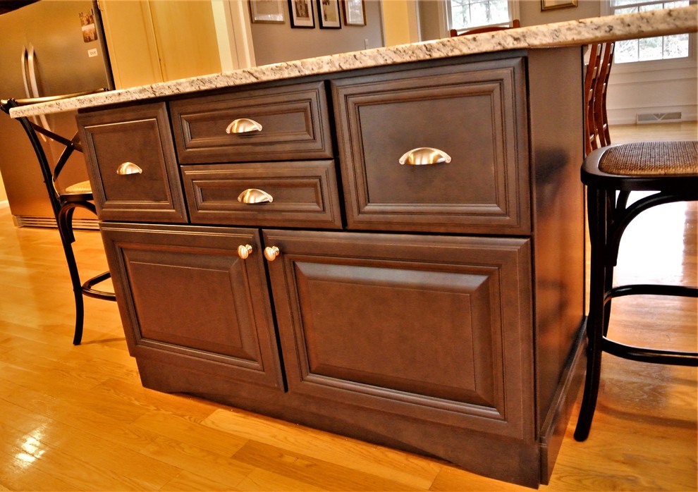 Inspiration for a transitional light wood floor eat-in kitchen remodel in Boston with granite countertops and an island