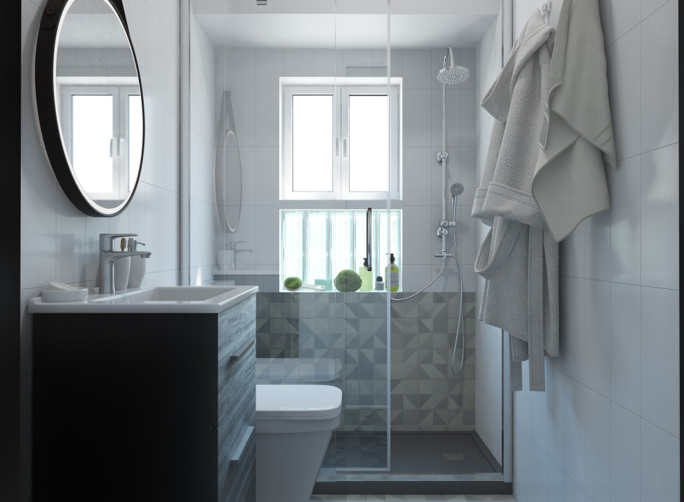 Exemple d'une petite salle de bain principale et grise et blanche scandinave avec un placard en trompe-l'oeil, des portes de placard blanches, une baignoire posée, un espace douche bain, WC à poser, un carrelage blanc, des carreaux de céramique, un mur blanc, sol en stratifié, un lavabo intégré, un sol gris, une cabine de douche à porte coulissante, un plan de toilette blanc, meuble simple vasque et meuble-lavabo encastré.