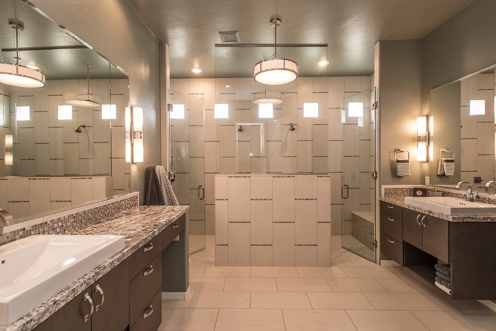 Large contemporary master bathroom in Phoenix with a vessel sink, flat-panel cabinets, dark wood cabinets, granite benchtops, a double shower, gray tile, ceramic tile, grey walls and ceramic floors.