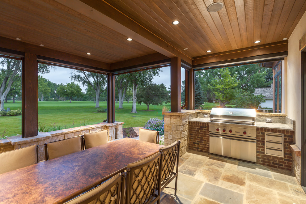 Patio - rustic backyard stone patio idea in Denver
