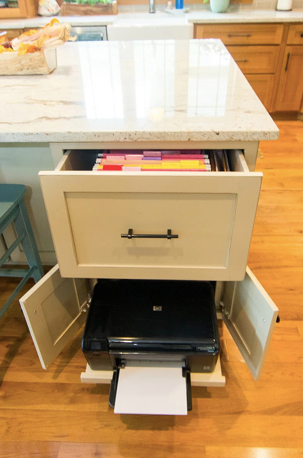 Example of a mid-sized transitional l-shaped medium tone wood floor and brown floor open concept kitchen design with a farmhouse sink, shaker cabinets, medium tone wood cabinets, quartzite countertops, gray backsplash, subway tile backsplash, stainless steel appliances, an island and white countertops