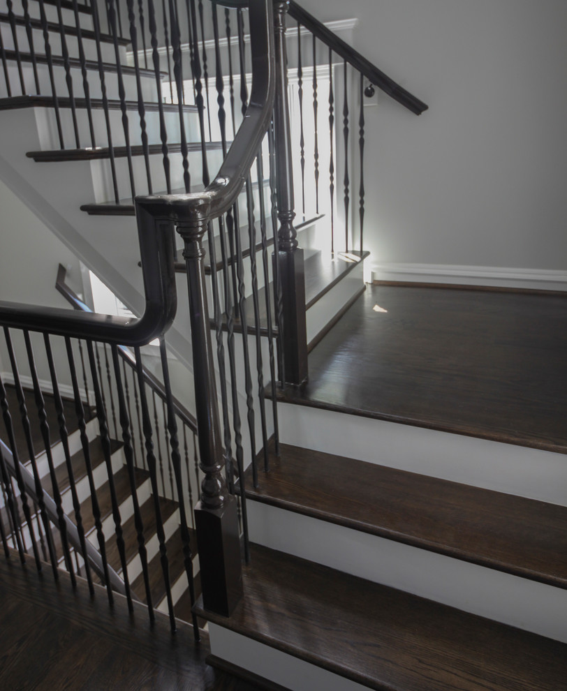 Inspiration for a large transitional wooden l-shaped mixed material railing staircase remodel in DC Metro with painted risers