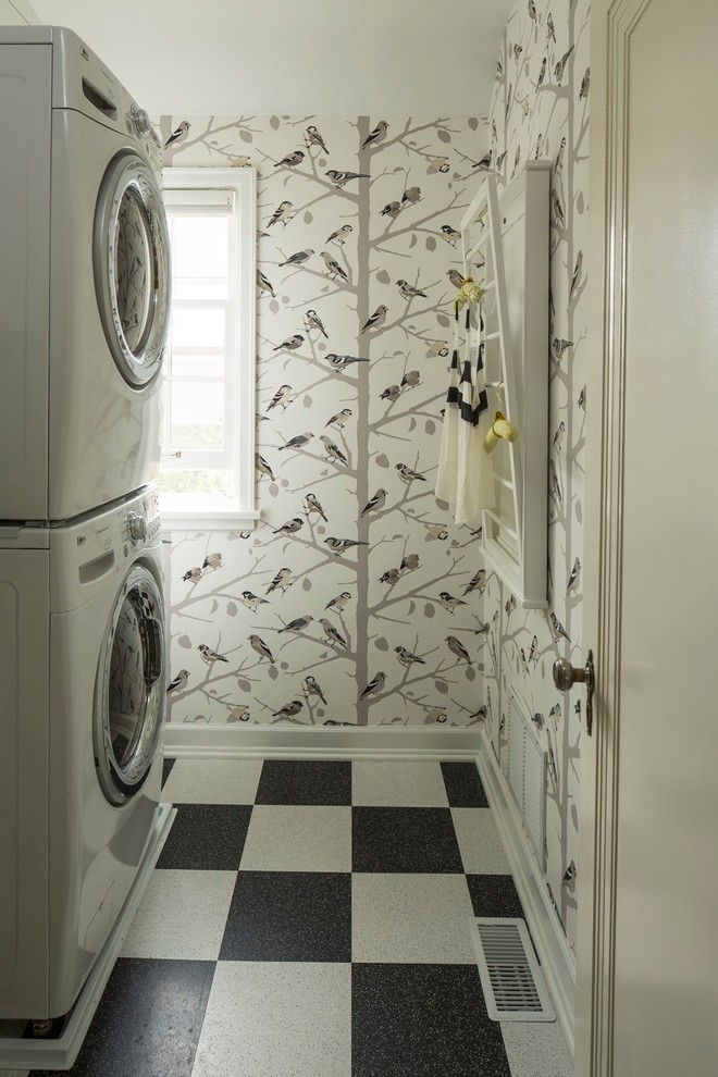 This is an example of an eclectic laundry room in Minneapolis with a stacked washer and dryer.