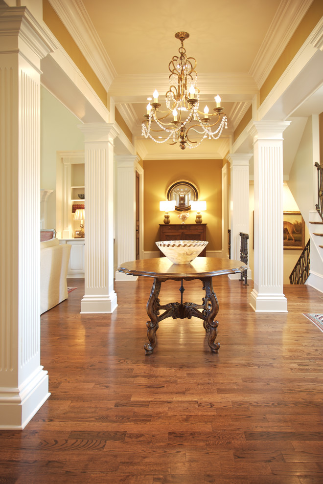 Design ideas for a traditional hallway in Atlanta with medium hardwood floors and brown floor.