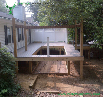 Inspiration for a small transitional side yard rectangular infinity pool fountain remodel in DC Metro