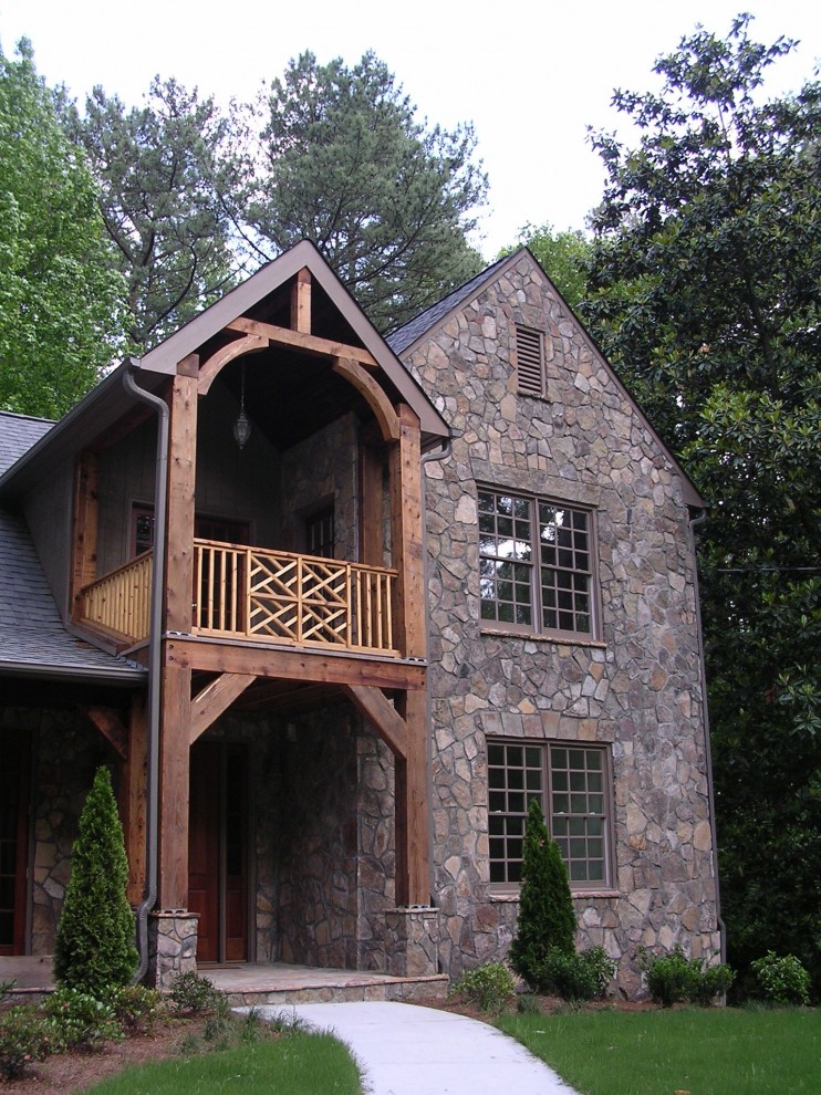 Inspiration for a country two-storey exterior in Atlanta with stone veneer.