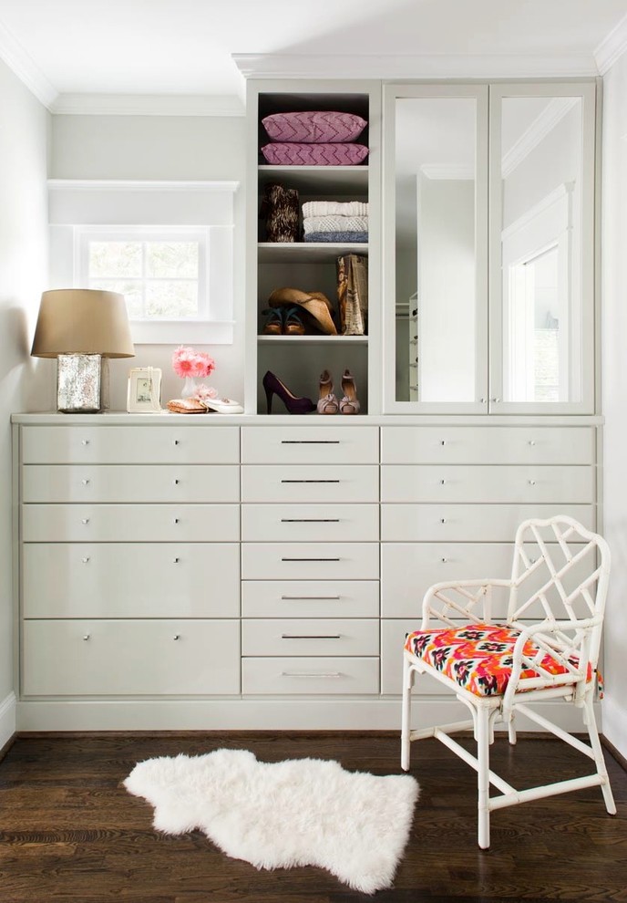Inspiration for a transitional women's storage and wardrobe in Atlanta with flat-panel cabinets and white cabinets.