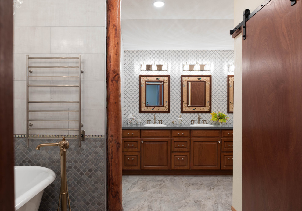 Large mountain style master gray tile and ceramic tile porcelain tile, gray floor and double-sink claw-foot bathtub photo in Seattle with dark wood cabinets, a one-piece toilet, white walls, a drop-in sink, quartz countertops, a hinged shower door, gray countertops and a built-in vanity