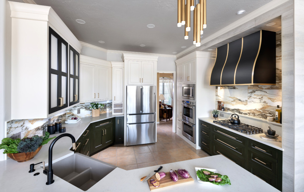 Inspiration for a large transitional u-shaped kitchen remodel in Oklahoma City with an undermount sink, shaker cabinets, white cabinets, quartz countertops, multicolored backsplash, porcelain backsplash, stainless steel appliances and white countertops