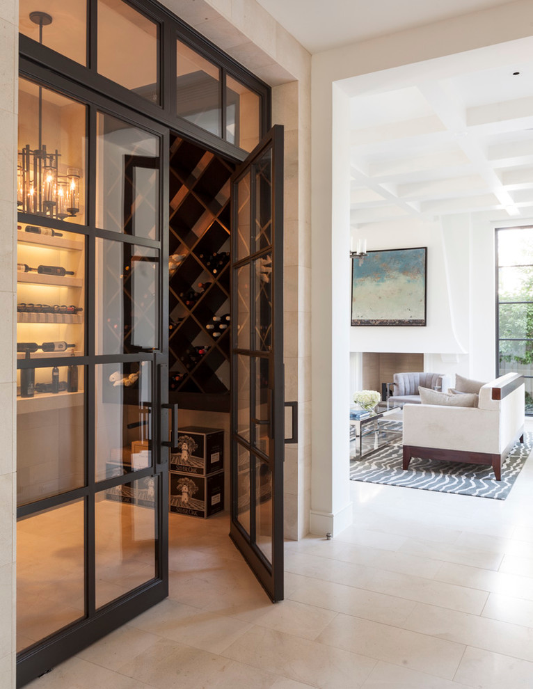 Design ideas for a mediterranean wine cellar in Dallas with beige floor.