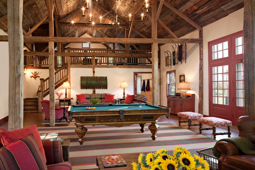 Example of a huge mountain style home design design in New York