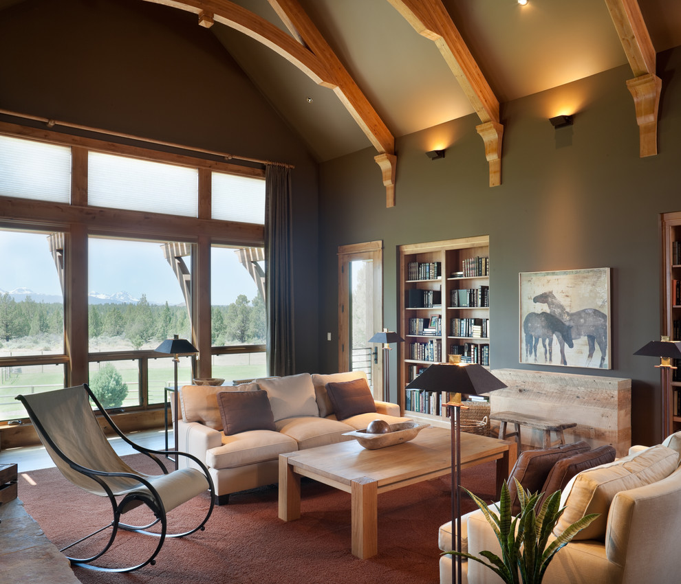 This is an example of a country family room in Portland with a library.