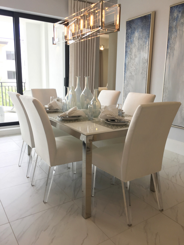 Example of a transitional white floor dining room design in Miami