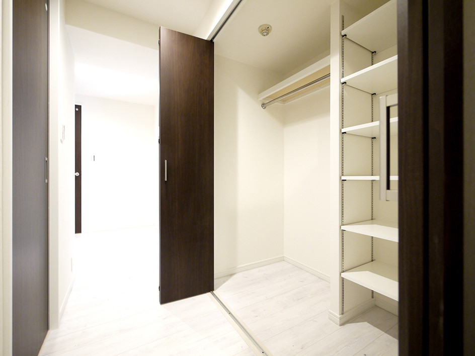 Design ideas for a modern hallway in Tokyo with white walls, plywood floors and white floor.