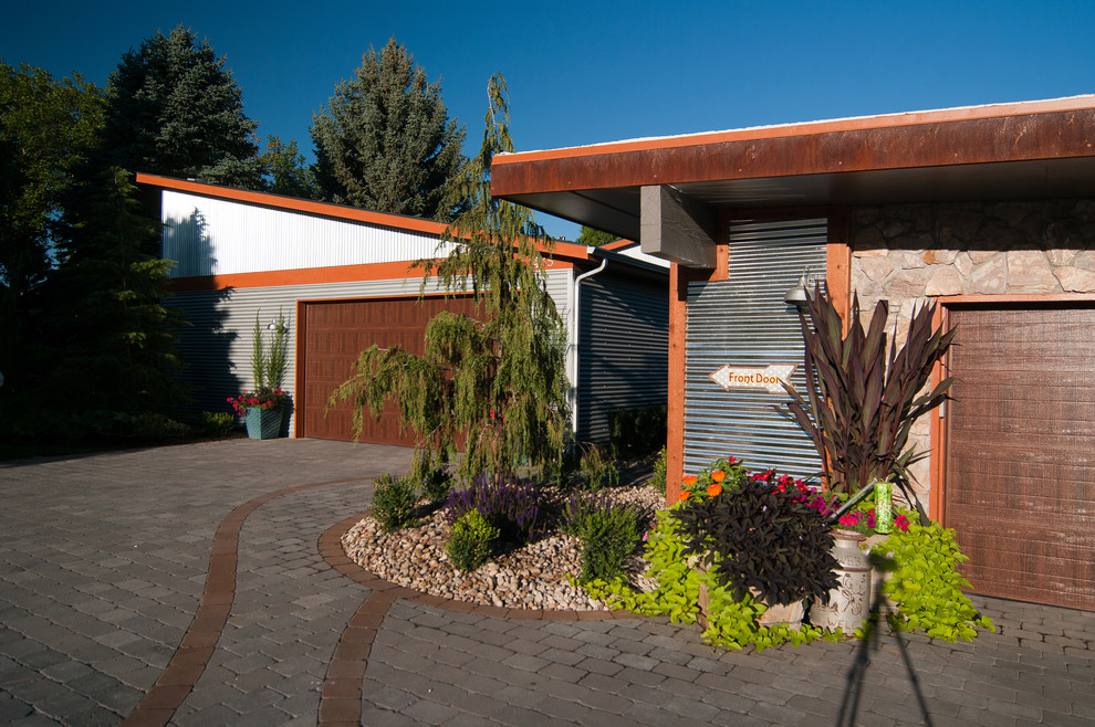 Inspiration for an eclectic front yard concrete paver driveway in Boise.
