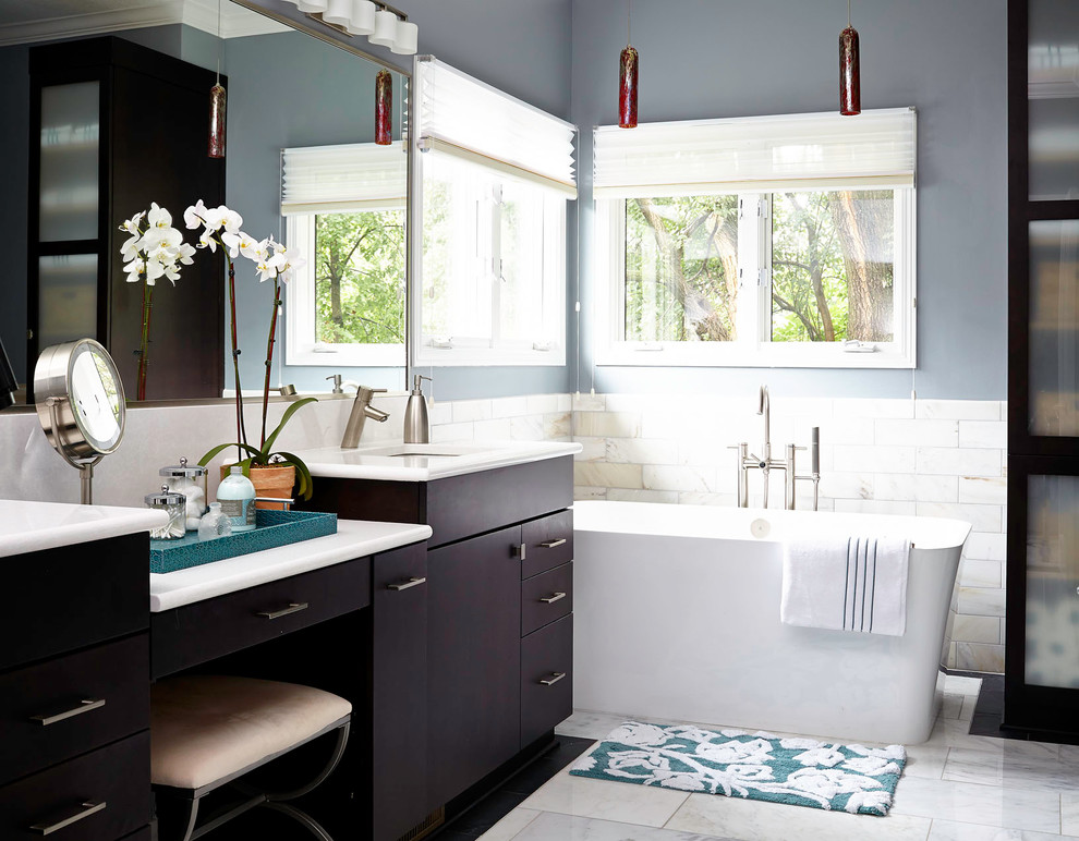 Design ideas for a mid-sized transitional master bathroom in Other with an undermount sink, dark wood cabinets, engineered quartz benchtops, a freestanding tub, an alcove shower, a one-piece toilet, gray tile, stone tile, grey walls and flat-panel cabinets.