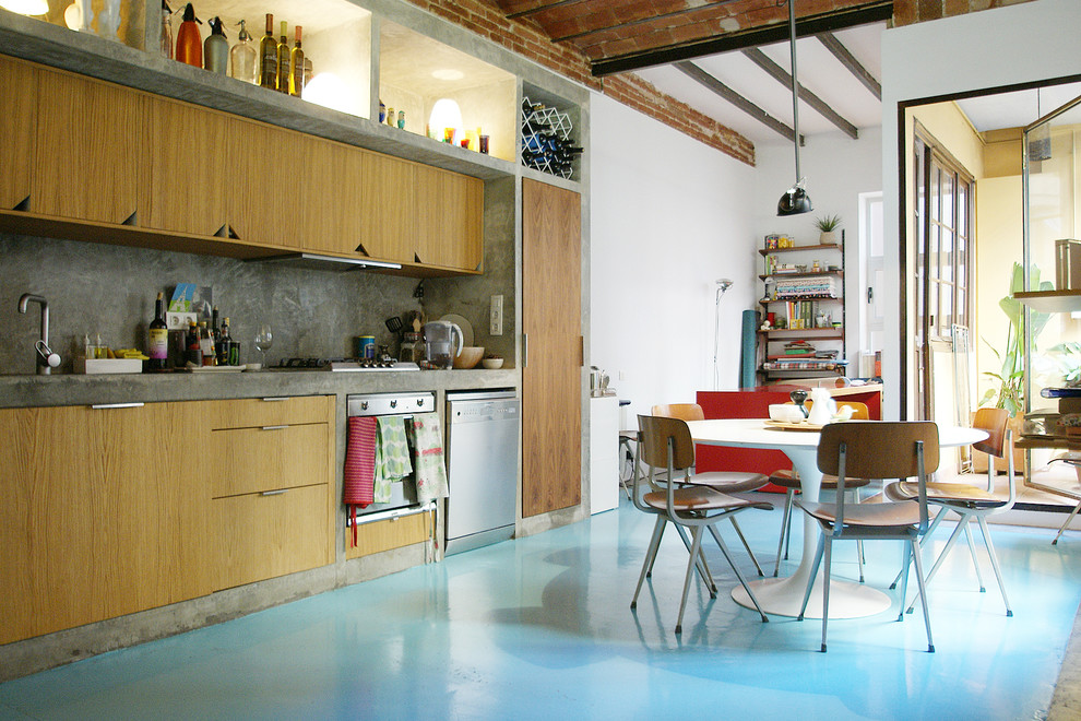 Large industrial single-wall eat-in kitchen in Barcelona with flat-panel cabinets, brown cabinets, concrete benchtops, grey splashback, cement tile splashback, stainless steel appliances, concrete floors and no island.