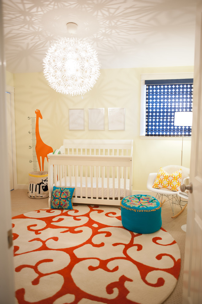 Photo of a mid-sized transitional gender-neutral nursery in Vancouver with yellow walls and carpet.