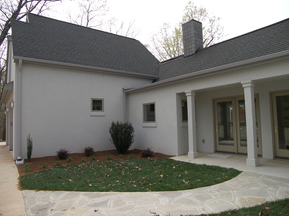 Example of a minimalist double front door design with a glass front door