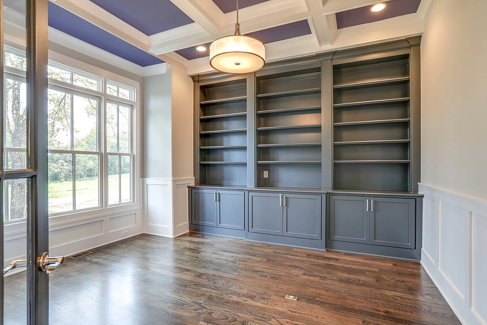 Mid-sized transitional study room in Nashville with grey walls, medium hardwood floors and coffered.