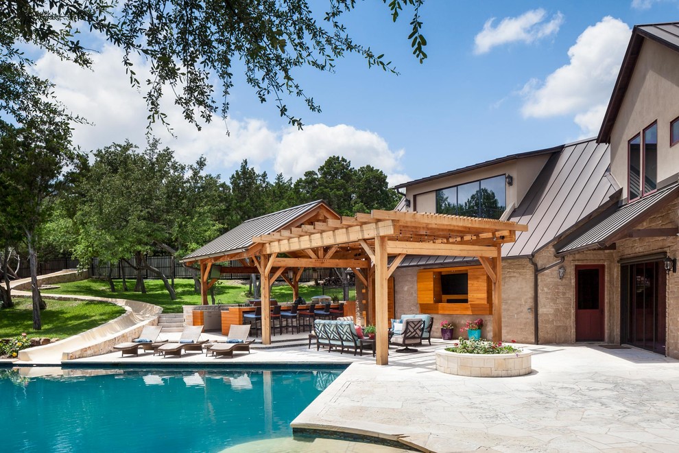 This is an example of an expansive transitional backyard deck in Austin with a container garden and a pergola.