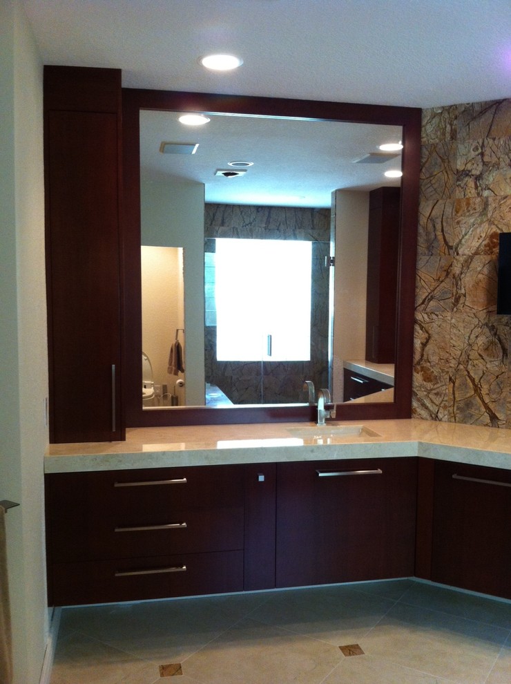 Inspiration for a large contemporary master bathroom in Miami with flat-panel cabinets, dark wood cabinets, marble benchtops, beige walls and travertine floors.