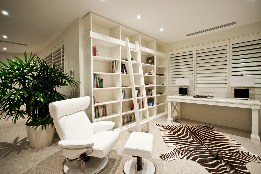 This is an example of a contemporary home office in Gold Coast - Tweed with carpet and a freestanding desk.