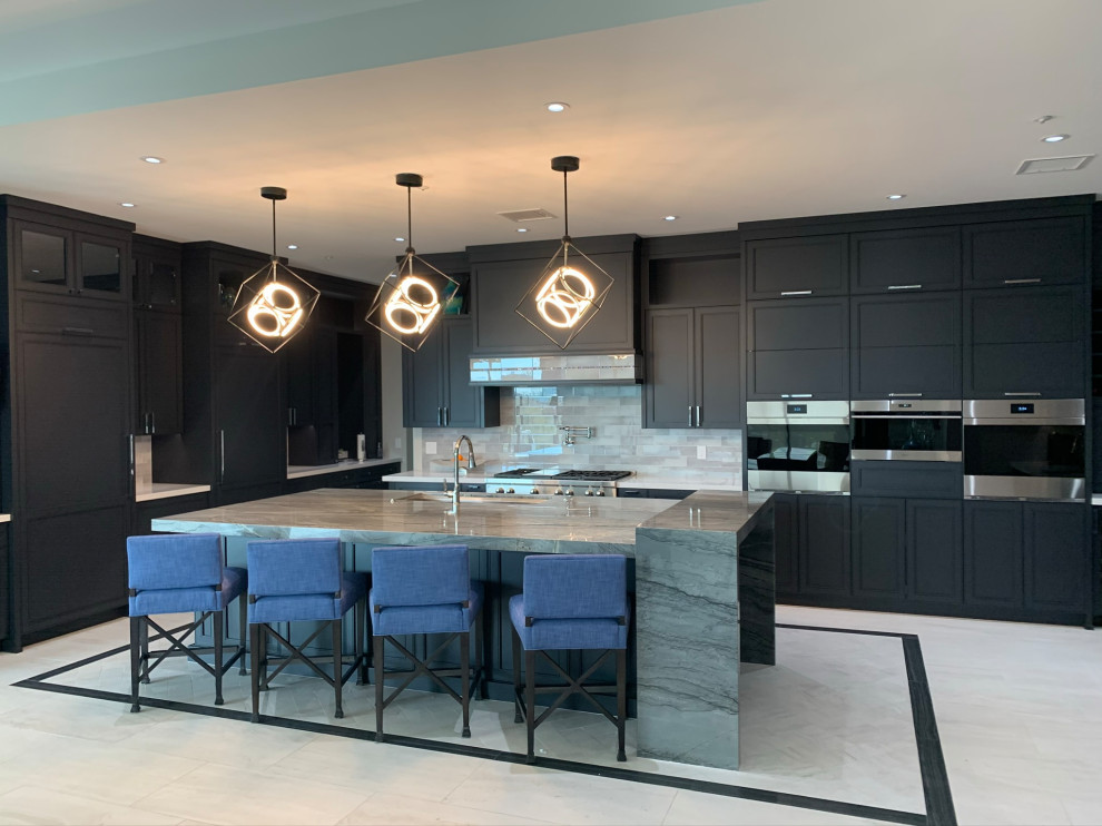 Eat-in kitchen - huge transitional u-shaped porcelain tile eat-in kitchen idea in Phoenix with a single-bowl sink, blue cabinets, quartzite countertops, green backsplash, stainless steel appliances, an island and gray countertops