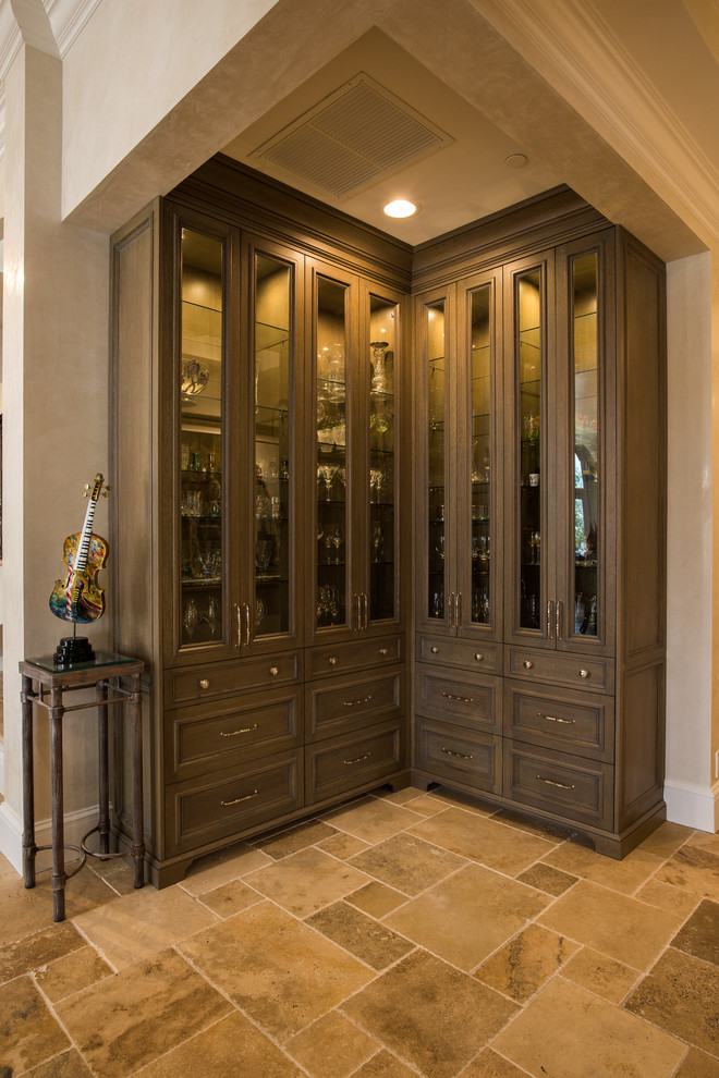Example of a large transitional travertine floor and brown floor kitchen design with beaded inset cabinets and dark wood cabinets