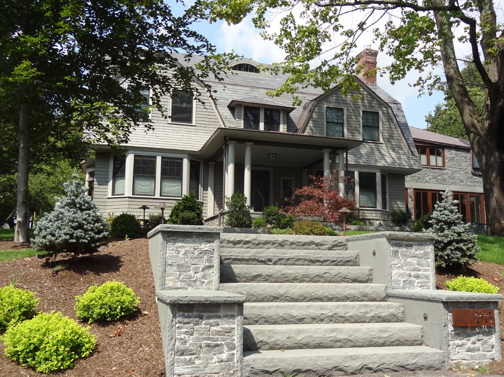 Traditional grey exterior in Boston with stone veneer.