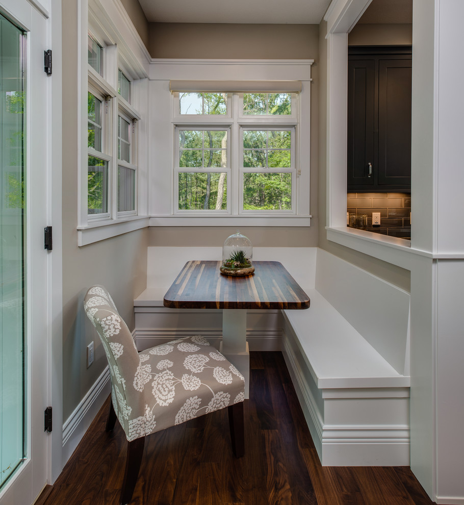 Inspiration for a large transitional single-wall medium tone wood floor eat-in kitchen remodel with an undermount sink, shaker cabinets, gray cabinets, granite countertops, gray backsplash, ceramic backsplash, stainless steel appliances and an island