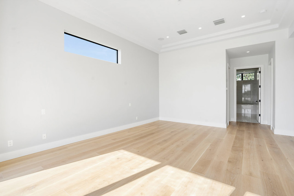 Example of a trendy home design design in Miami