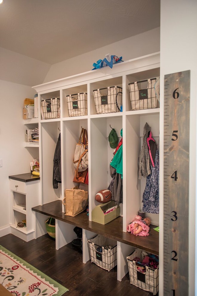 Design ideas for a large transitional mudroom in Other with white walls and dark hardwood floors.