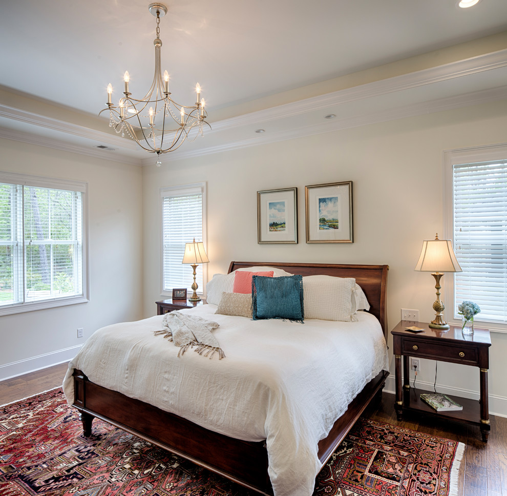 Photo of a traditional guest bedroom in Other with beige walls, dark hardwood floors, brown floor and no fireplace.
