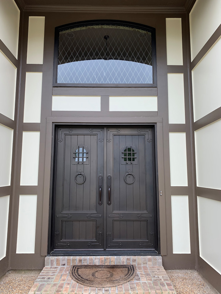 Example of a front door design in Jackson with a metal front door