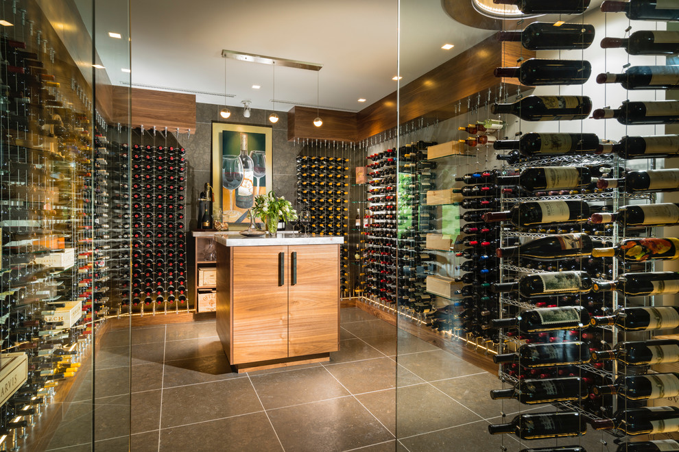 Contemporary wine cellar in St Louis with grey floor and storage racks.