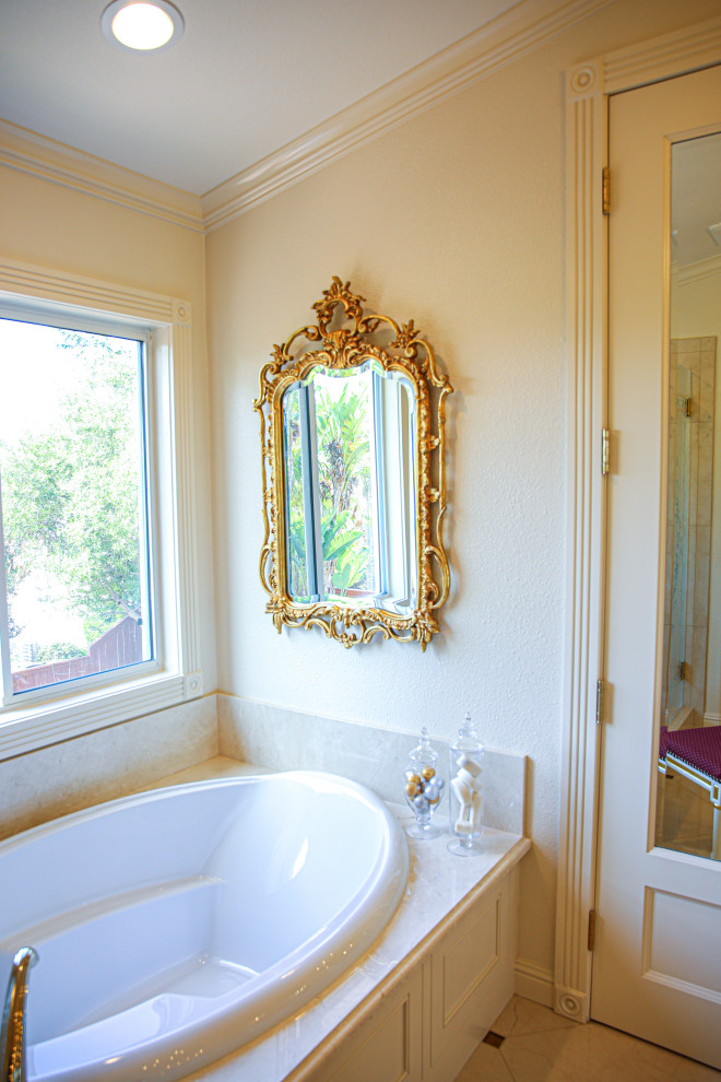 Inspiration for a large victorian master ceramic tile, white floor and double-sink bathroom remodel in San Diego with furniture-like cabinets, white cabinets, a two-piece toilet, white walls, an undermount sink, quartz countertops, a hinged shower door, white countertops and a built-in vanity