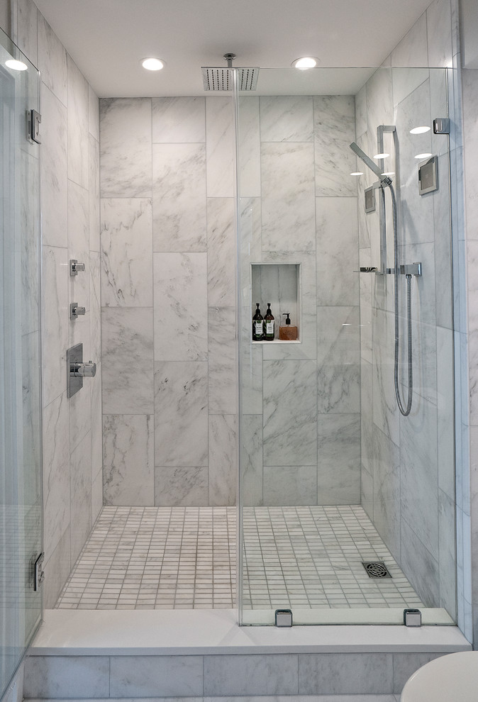 Inspiration for a small modern master bathroom in DC Metro with flat-panel cabinets, white cabinets, an alcove shower, a one-piece toilet, white tile, marble, white walls, marble floors, an undermount sink, engineered quartz benchtops, white floor, a hinged shower door and white benchtops.