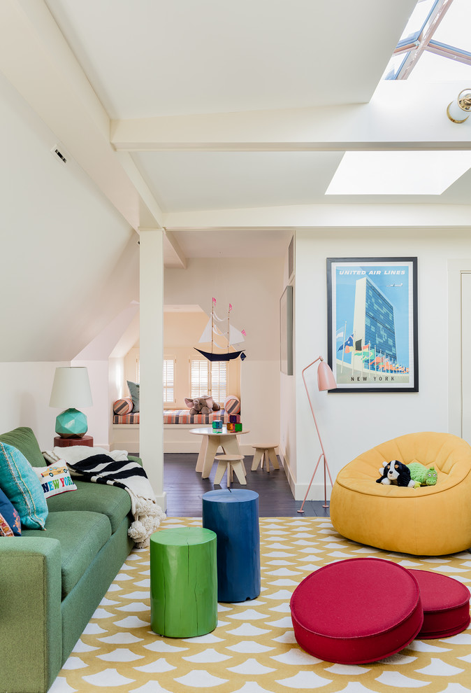 Inspiration for a transitional gender-neutral kids' playroom in Boston with white walls.
