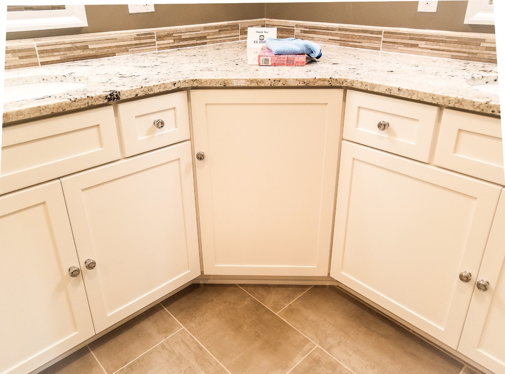 Inspiration for a large transitional master multicolored tile and ceramic tile porcelain tile and gray floor freestanding bathtub remodel with shaker cabinets, white cabinets, a two-piece toilet, gray walls, an undermount sink, granite countertops and a hinged shower door