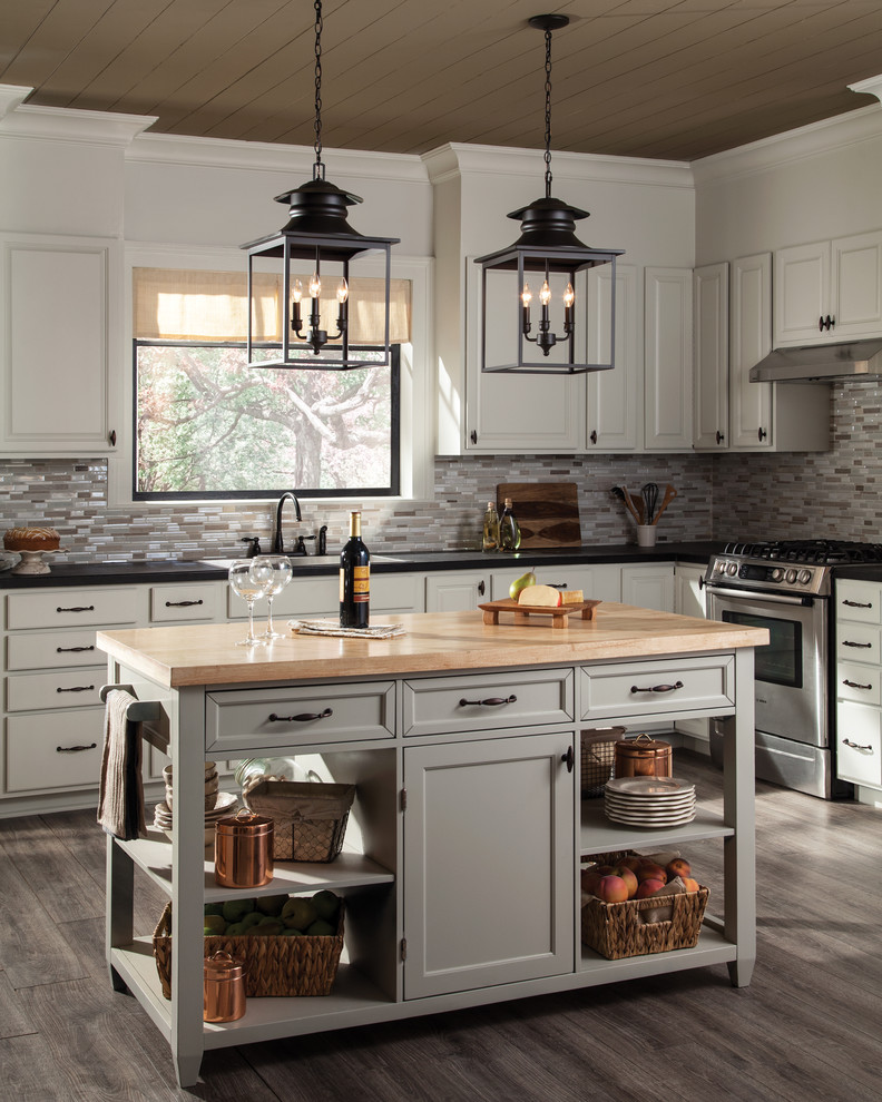 Mid-sized traditional l-shaped kitchen in Other with a drop-in sink, raised-panel cabinets, grey cabinets, grey splashback, matchstick tile splashback, dark hardwood floors, with island and grey floor.