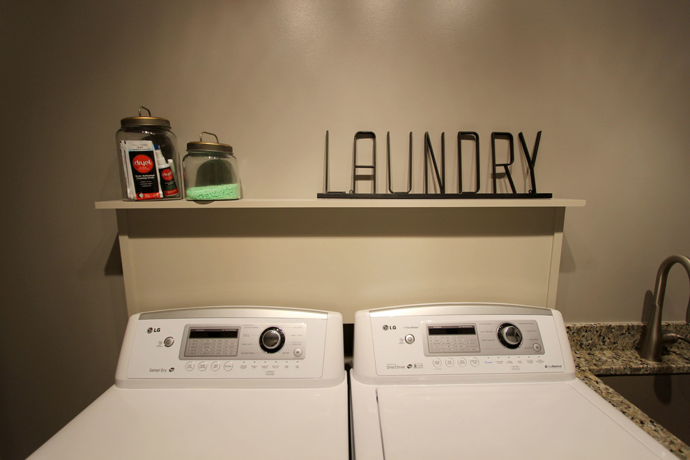 Design ideas for a small transitional single-wall dedicated laundry room in Cleveland with an undermount sink, flat-panel cabinets, beige cabinets, granite benchtops, beige walls, vinyl floors, a side-by-side washer and dryer, beige floor and beige benchtop.