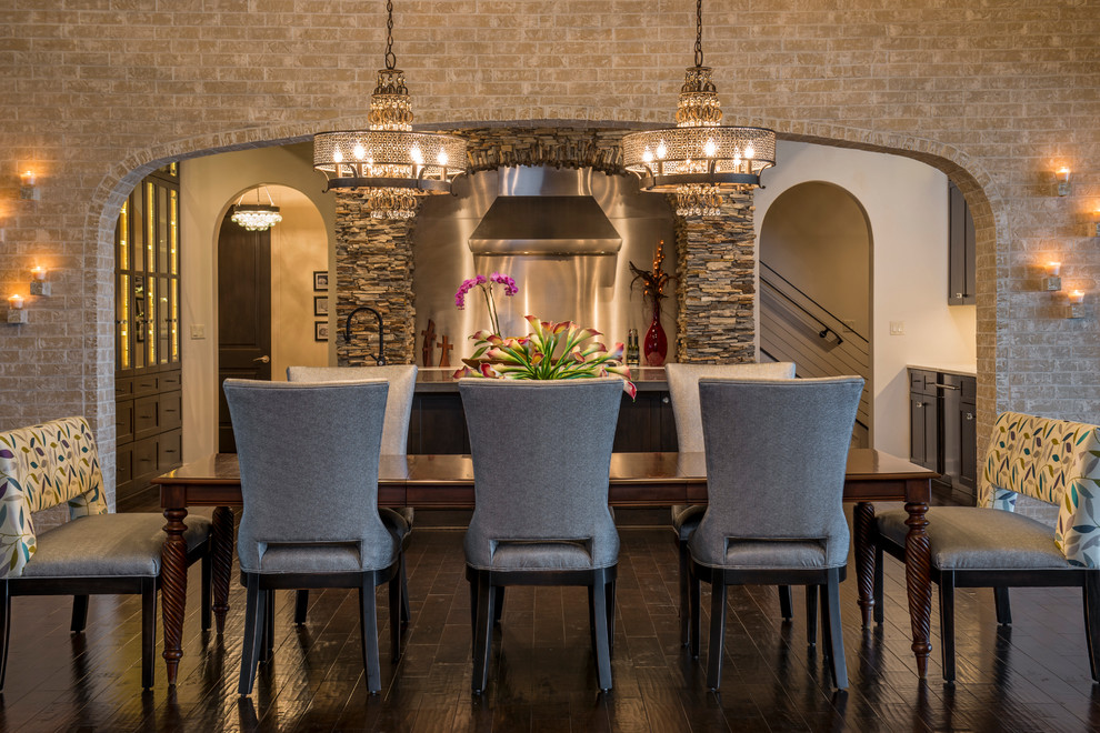 This is an example of a large mediterranean kitchen/dining combo in Austin with beige walls.
