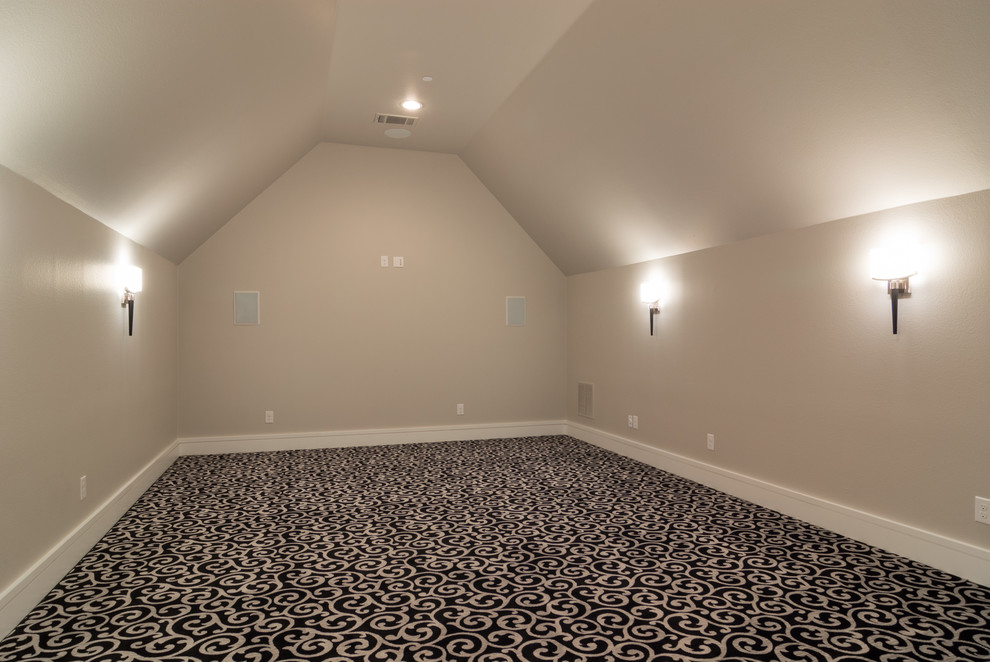 Photo of a large transitional enclosed home theatre in Dallas with grey walls, carpet and a wall-mounted tv.