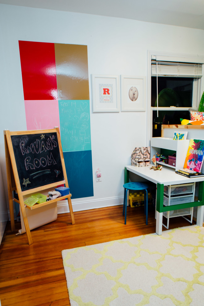 This is an example of a small contemporary kids' bedroom for kids 4-10 years old and girls in New York with grey walls, dark hardwood floors and brown floor.