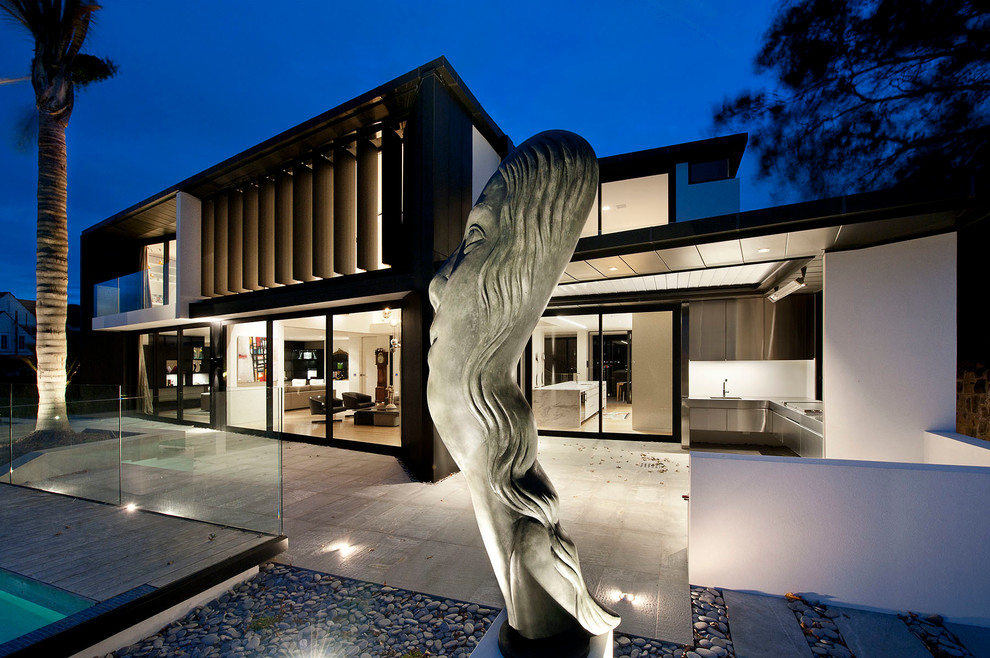 Inspiration for a contemporary two-storey exterior in Auckland.